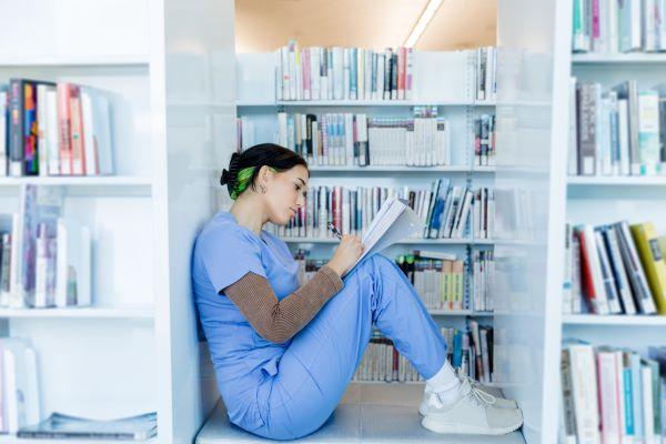 a medical student studying in a library