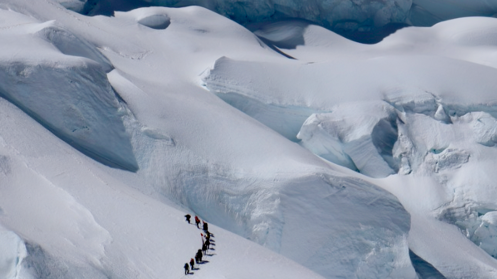 hikers on a glacier