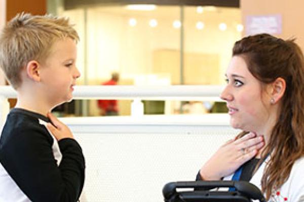 Student and Young boy learning about the larynx