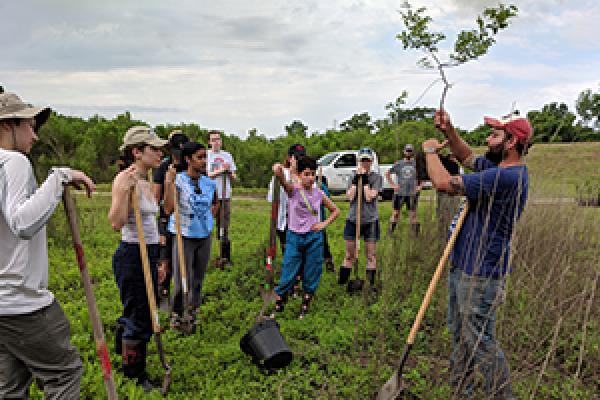 Ohio State students learn about saplings they are about to plant during a field school in southern Louisiana. Photo credit: Mary Thomas Ohio State students learn about saplings they are about to plant during a field school in southern Louisiana. Photo credit: Mary Thomas