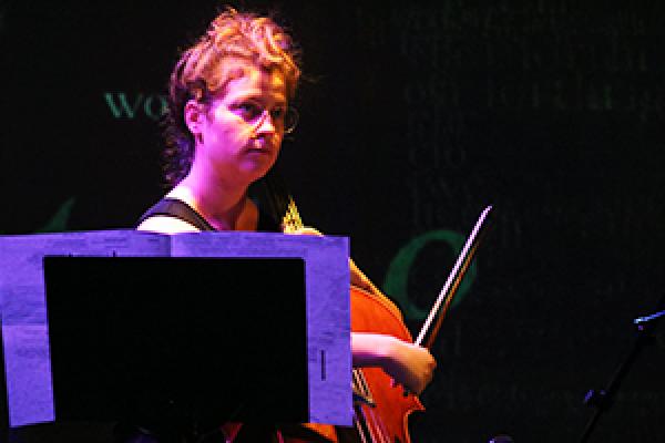 Caitlyn Trevor plays the cello in the ACCAD Motion Lab.