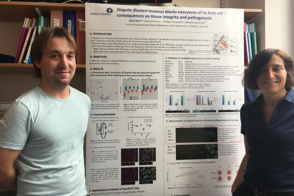 Adam Bercz stands with his principal investigator, Dr. Nathalie Sauvonnet, after preparing his poster Adam Bercz stands with his principal investigator, Dr. Nathalie Sauvonnet, after preparing his poster