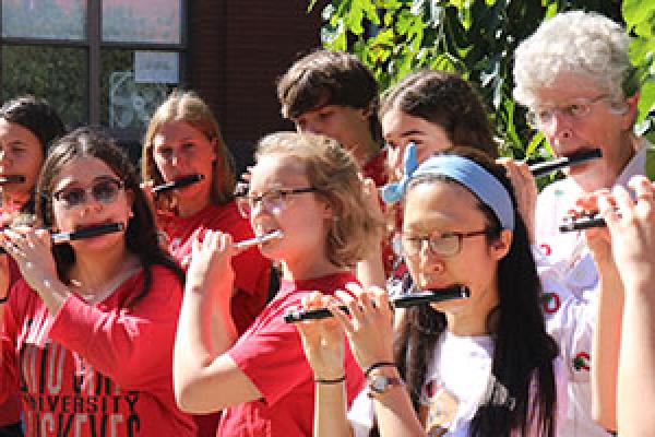 Members of Ohio State's Flute Troupe play piccolo