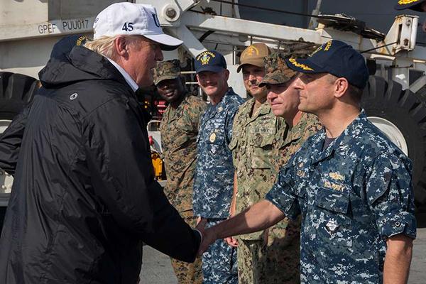 President Donald Trump shakes hands with Capt. David Guluzian of the U.S. Navy President Donald Trump shakes hands with Capt. David Guluzian of the U.S. Navy