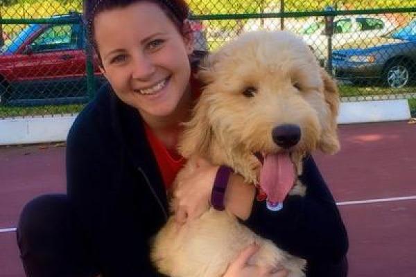alumna with puppy