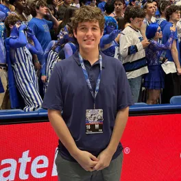 Noah Weiskopf in front of a group of fans