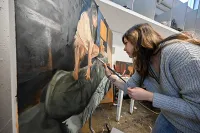 Ohio State student artist Kasmira Snyder painting
